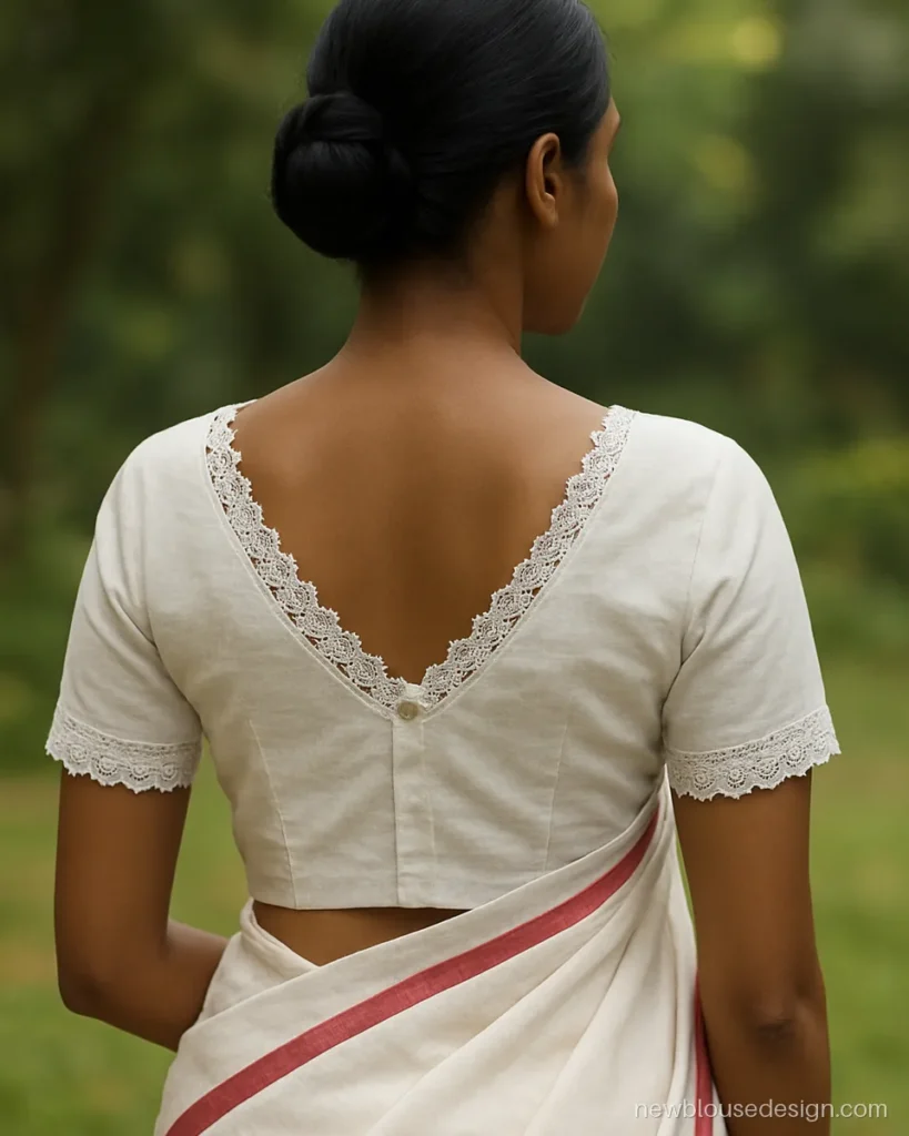 White cotton blouse back with a crochet lace V neck and button