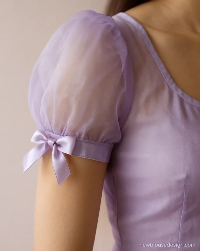 Lavender puff sleeve blouse with a ribbon bow at the sleeve band