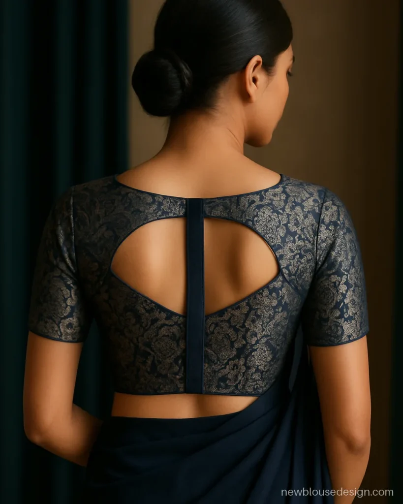 Navy brocade blouse back design with two side cut-outs and a centre strap