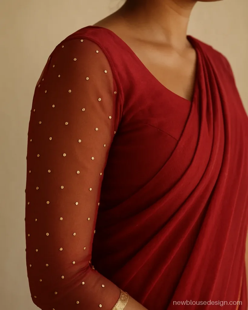 Red georgette blouse with full sheer sleeves and scattered sequins