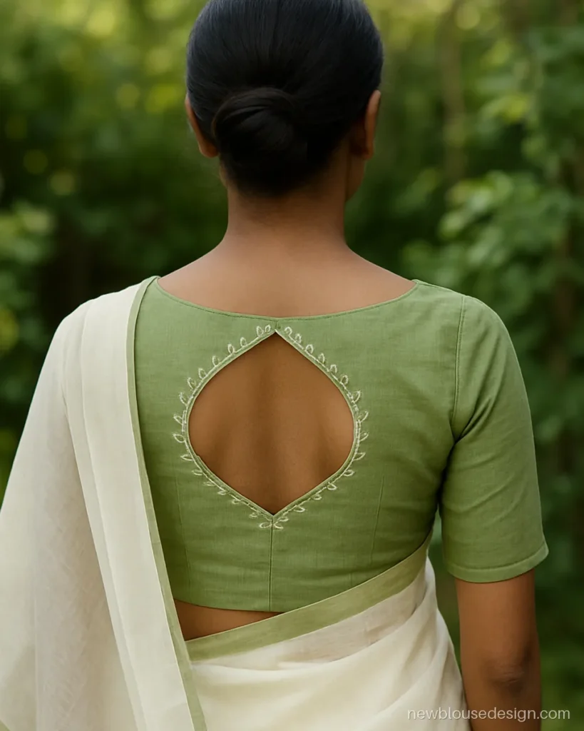 Pista colour blouse back design with leaf shaped neck and white thread work