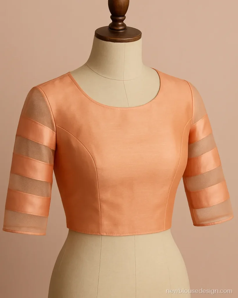 Peach blouse with elbow sleeves in alternating bands of silk and sheer net
