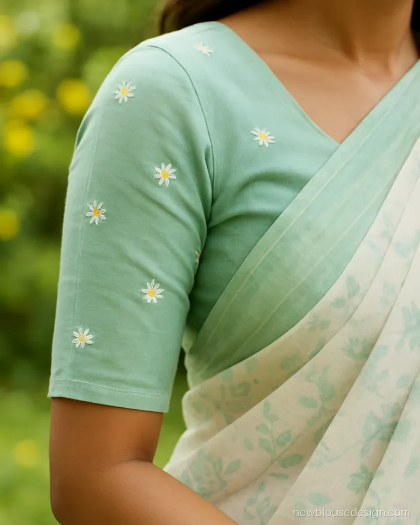 Flower sleeve design for blouse with white daisies scattered on mint elbow sleeves