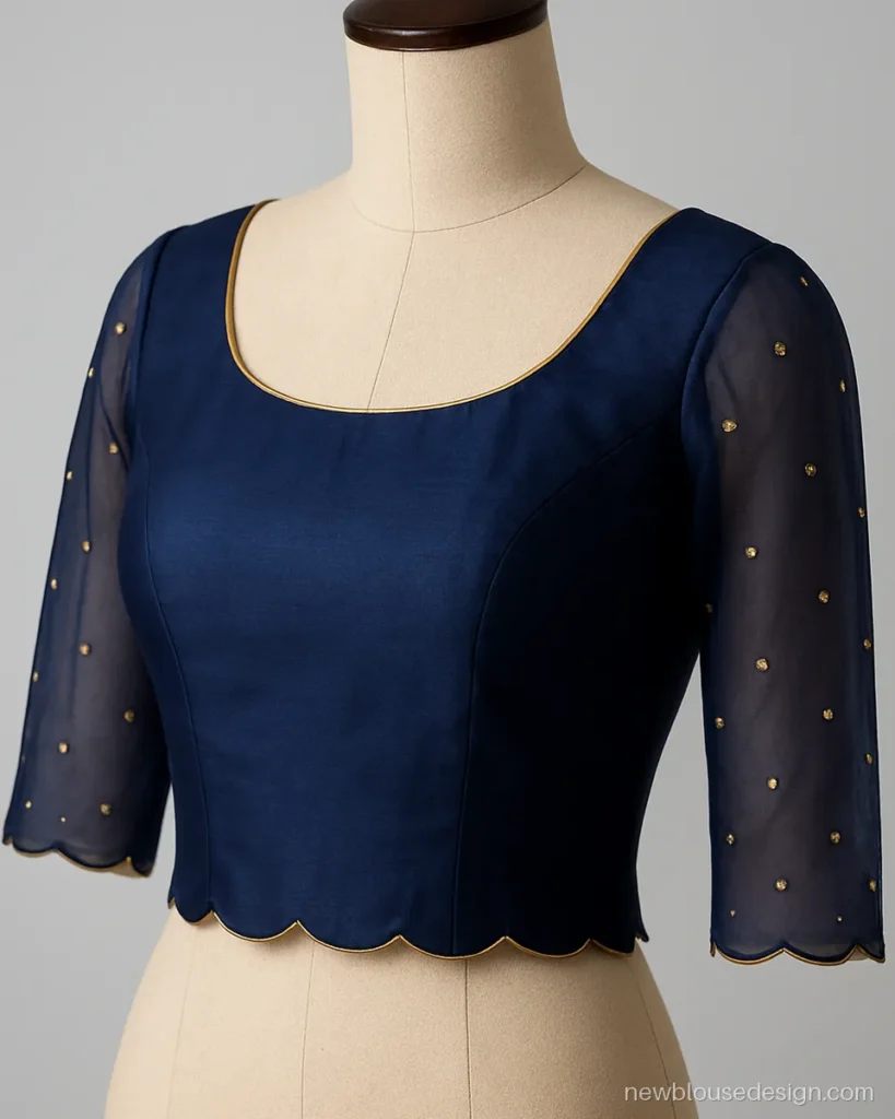 Navy silk blouse with sheer net three quarter sleeves and gold sequin butti