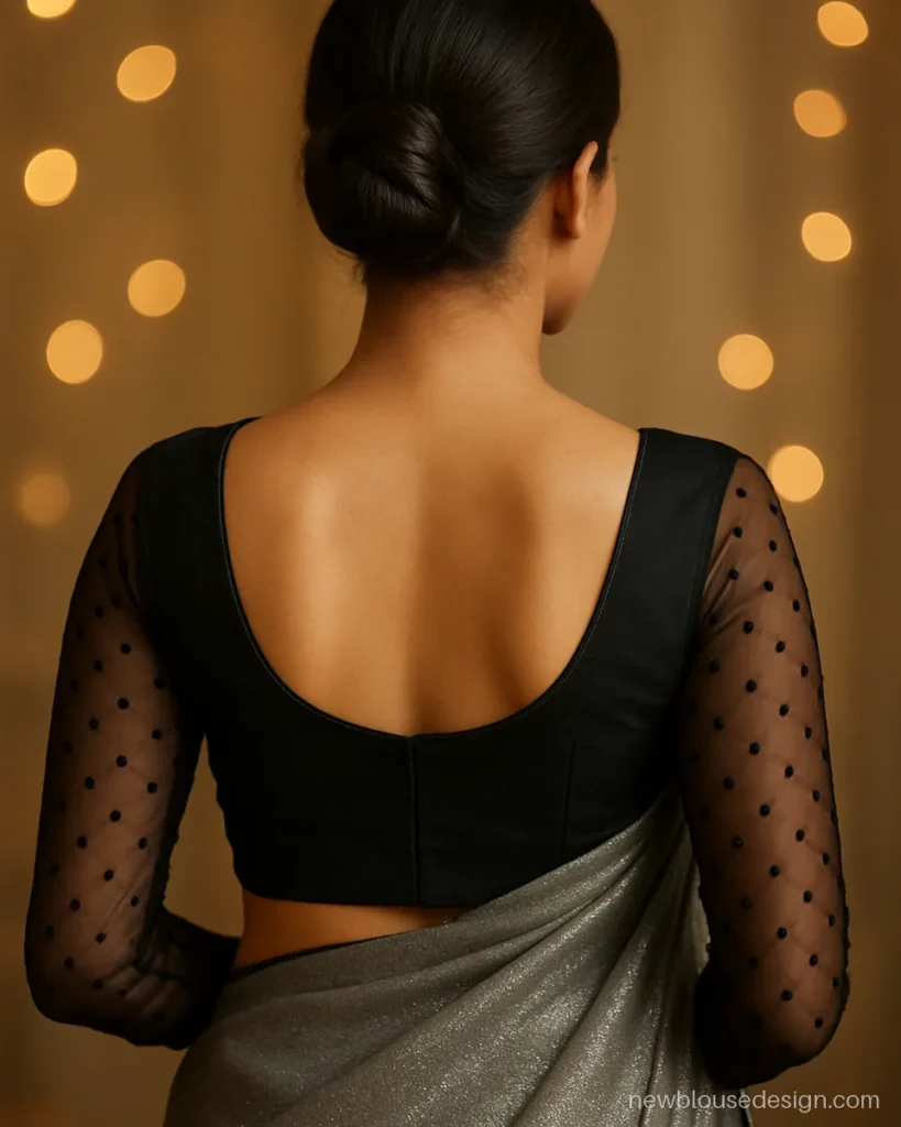 Black net full sleeves with velvet polka dots and a deep U back