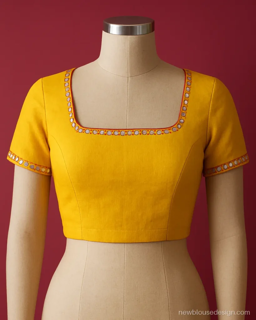 Square neck front blouse in yellow cotton with small mirror work on the edge