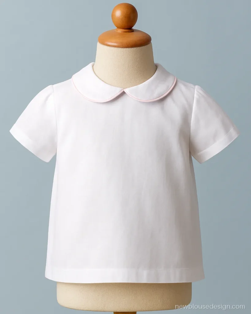 Simple kids blouse design in white cotton with a rounded peter pan collar
