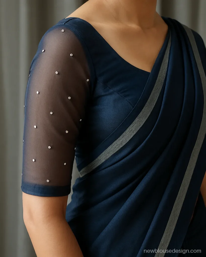 Navy net sleeves with scattered stone work on a silk blouse
