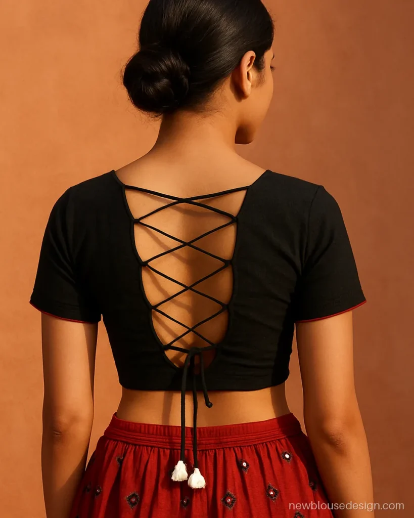 Black choli with criss-cross dori back and shell latkans