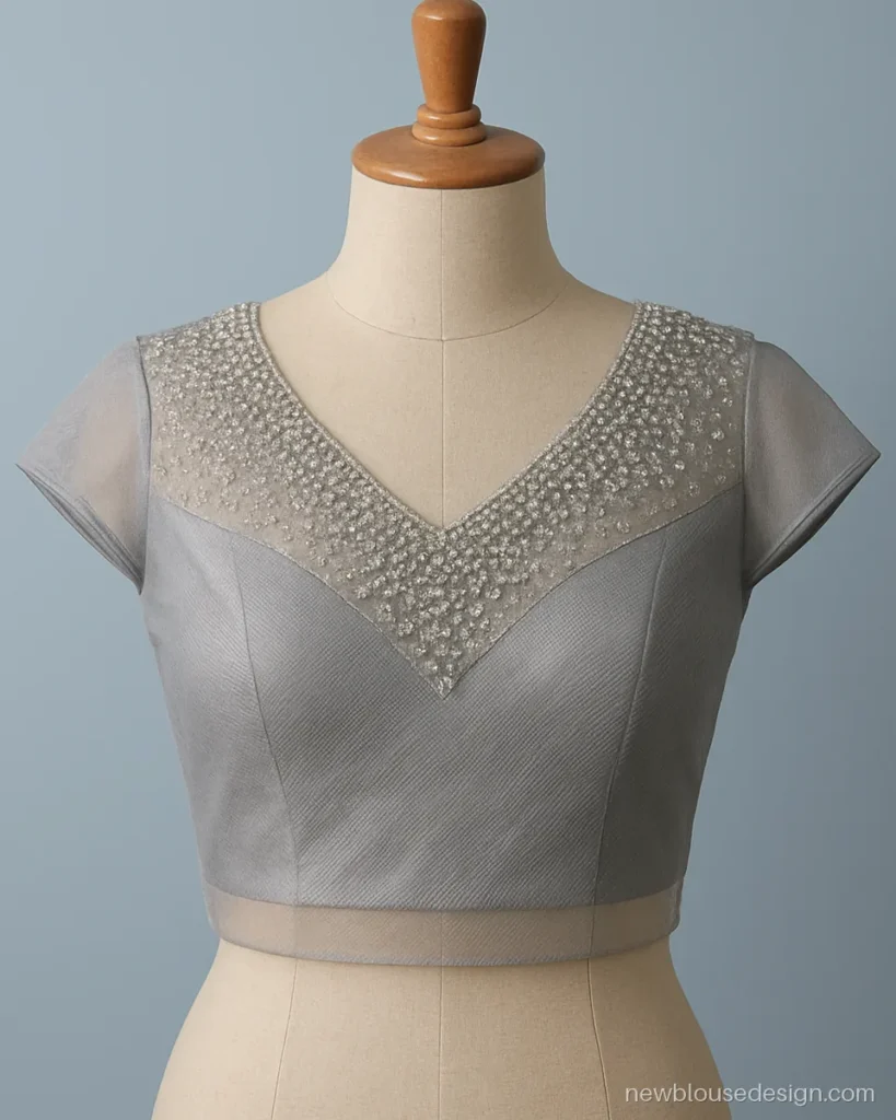 Silver grey net blouse front with cutdana and bead yoke in V shape