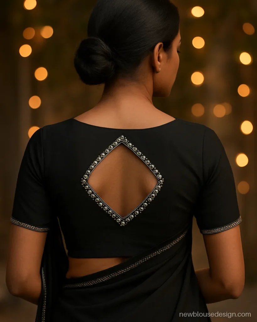 Black georgette blouse with diamond shaped back opening outlined in small mirrors