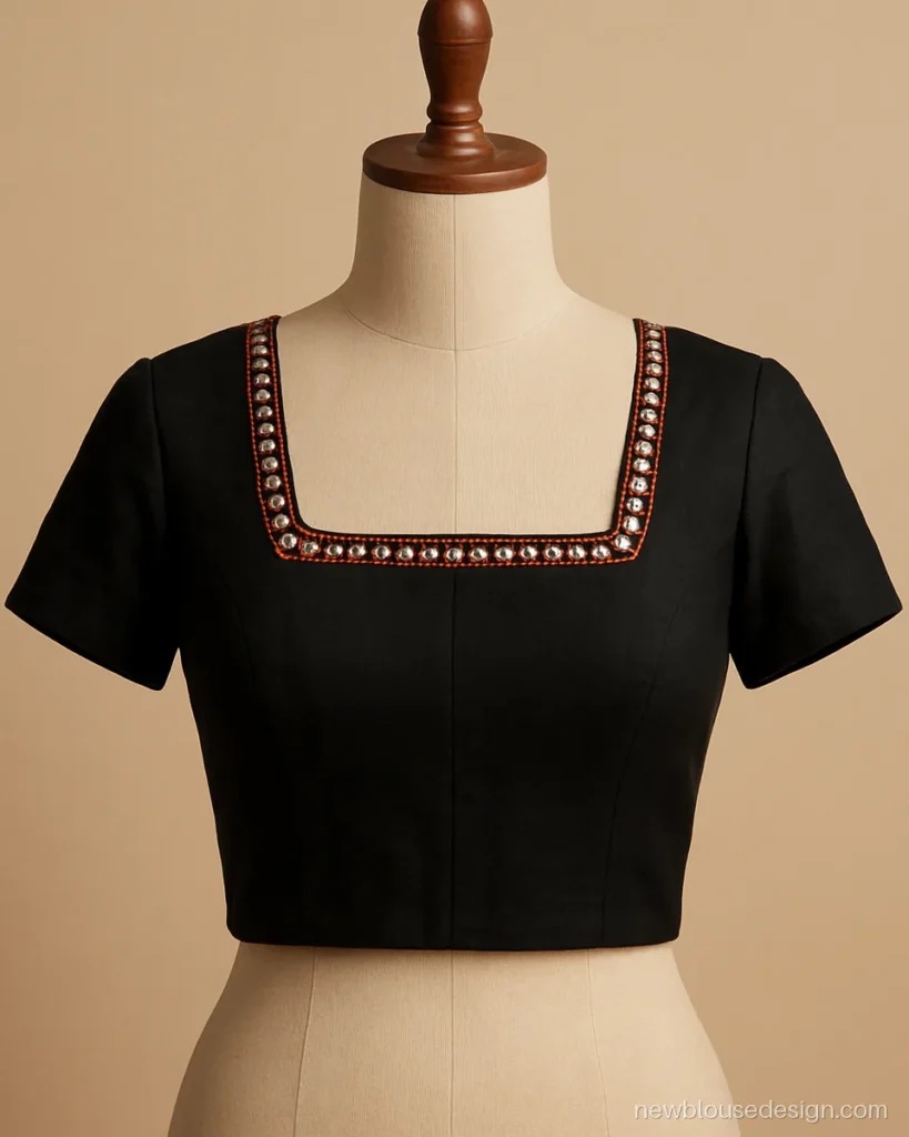 Black cotton blouse front with a square neck framed by small mirror work