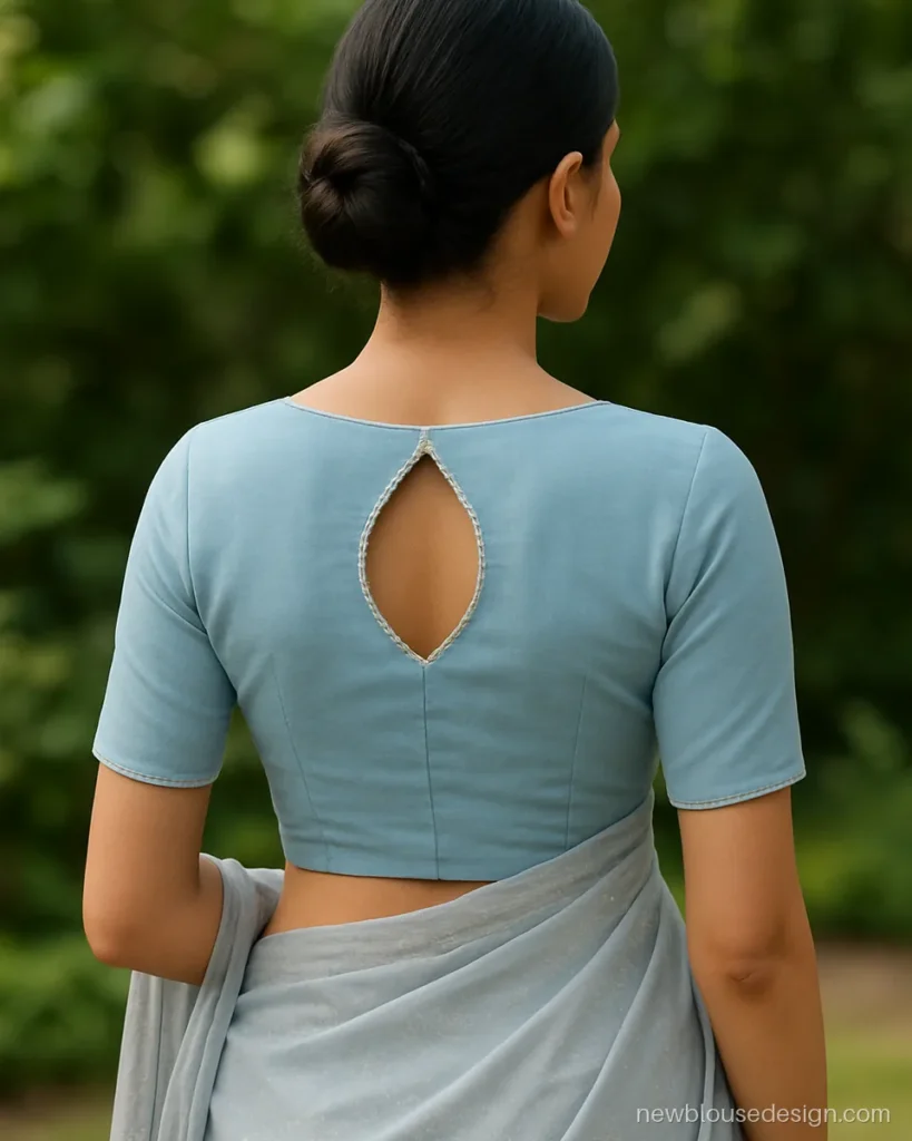 Powder blue princess cut blouse back design with leaf shaped cut-out and pearl edge