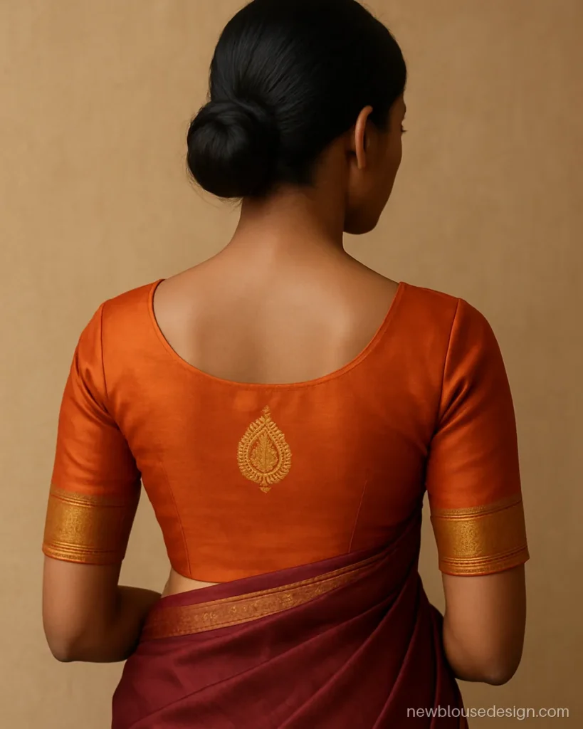 Traditional silk blouse with temple border on elbow sleeves and mango motif on back