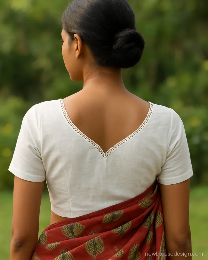 Back neck white blouse design in cotton with paan leaf shape and cutwork edge
